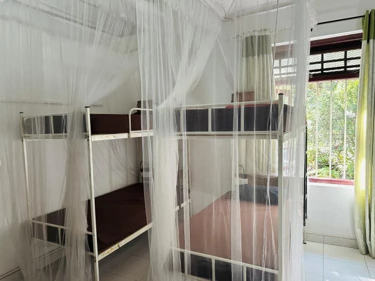 8-bed female dorm with mosquito nets