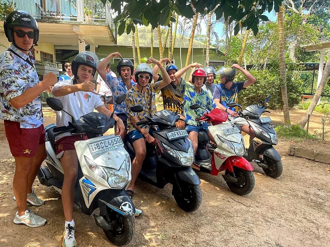 Guests heading out on a scooter tour